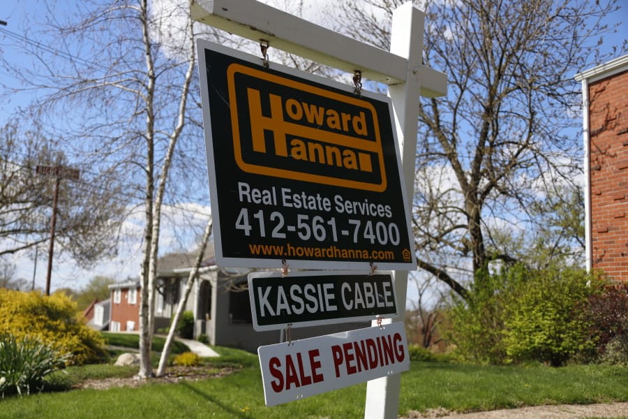 FILE - In this April 27, 2020 file photo shows a sale pending sign on a home in Mount Lebanon, Pa   The National Association of Realtors releases its April report on pending home sales, which are seen as a barometer of future purchases on Thursday, May 28.(AP Photo/Gene J.