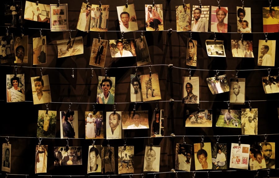 FILE - In this Friday, April 5, 2019 file photo, family photographs of some of those who died hang on display in an exhibition at the Kigali Genocide Memorial centre in the capital Kigali, Rwanda. Felicien Kabuga, one of the most wanted fugitives in Rwanda&#039;s 1994 genocide who had a $5 million bounty on his head, has been arrested in Paris, authorities said Saturday, May 16, 2020.