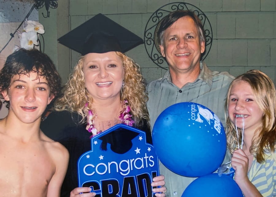This 2009 photo provided by the Biel family, shows the late Kristen Biel, at her graduation party, with her husband Darryl Biel and their two children, Dylan and Delaney.  On Monday, the Supreme Court will hear arguments in a disability discrimination lawsuit she filed against her former employer, St. James Catholic School in Torrance, California. A judge initially sided with the school and halted the lawsuit, but an appeals court disagreed and said it could go forward.