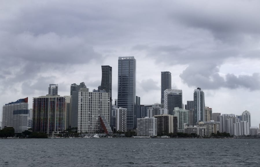 Clouds loom over the Miami skyline Thursday, May 14, 2020. According to the National Hurricane Center website, &quot;A trough of low pressure over the Straits of Florida is producing a large area of cloudiness and thunderstorms.