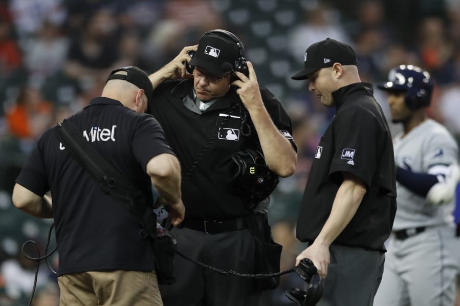 Home plate umpire Paul Emmel and umpire Mike Estabrook reviewing a play during a game last season. Major League Baseball and its umpires have reached a deal to cover a 2020 pay structure during the coronavirus pandemic. As part of the deal, MLB has the right not to use instant replays of umpires&#039; decisions during the 2020 season.