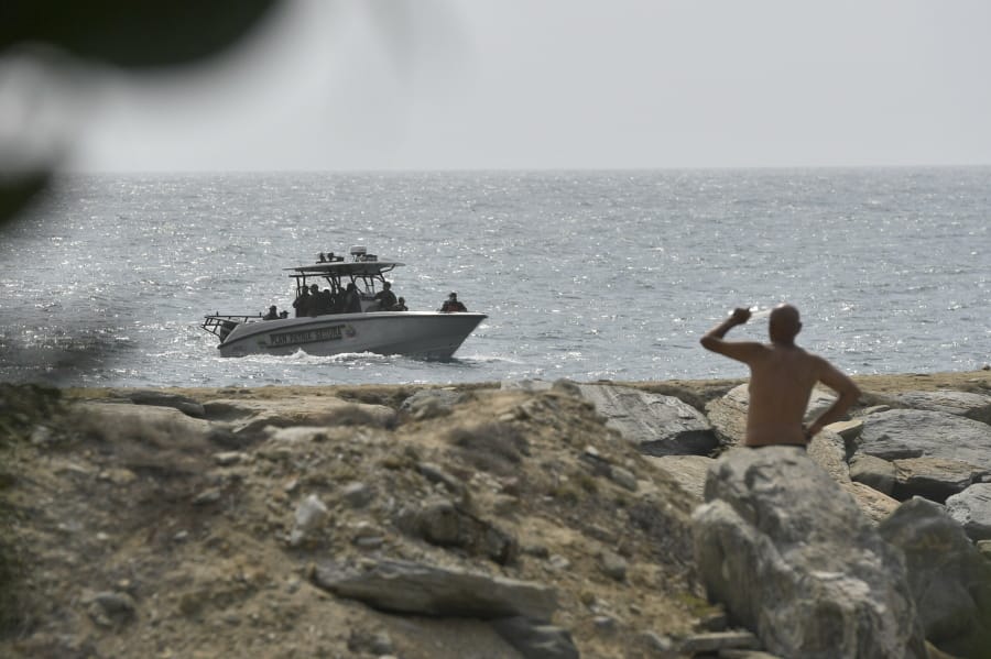 Security forces patrol near the shore in the port city of La Guaira, Venezuela, Sunday, May 3, 2020. Interior Minister Nestor Reverol said on state television that security forces overcame before dawn Sunday an armed maritime incursion with speedboats from neighboring Colombia in which several attackers were killed and others detained.