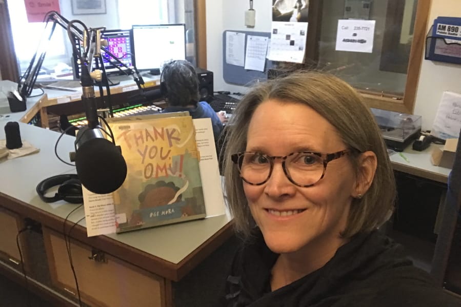 Librarian Claudia Haines takes a selfie April 2 while preparing to read stories on the air at local radio station KBBI in Homer, Alaska. The library teamed up with the station to continue its popular story hour for preschoolers after it closed to the public amid coronavirus concerns. It&#039;s among ways the nation&#039;s libraries are dealing with closures amid coronavirus concerns.