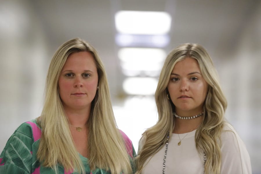 First grade teachers, Ellie Morgan, 25, left, Hannah Sprayberry, 28, right, pose for a portrait, and say they are taking around 5 per-cent pay cut on Thursday, May 28, 2020, in Fort Oglethorpe, Ga. With sharp declines in state spending projected because of the economic fallout from the COVID-19 pandemic, America&#039;s more than 13,000 local school systems are wrestling with the likelihood of big budget cuts.