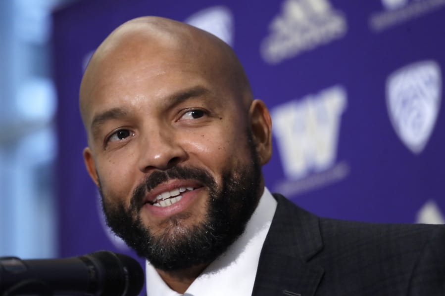 FILE - In this Dec. 3, 2019, file photo, Washington NCAA college football defensive coordinator Jimmy Lake speaks during a news conference about taking over the head coaching position, in Seattle. Just when it seemed like things were up and rolling, the COVID-19 pandemic hit. The ensuring national shutdown hurt coaches across college football as they prepare for next season, but it was particularly difficult on programs with first-year coaches trying to build something from the ground up.