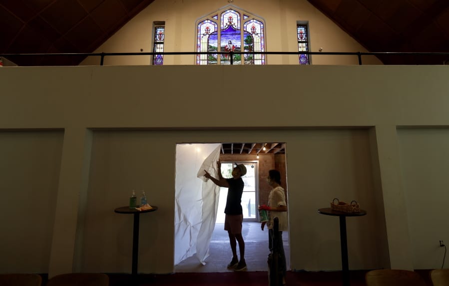 Alamo Heights Baptist Church pastor Bobby Contreras, left, and his wife Hannah, work to clean, sanitize and prepare the church for services this Sunday, in San Antonio, Wednesday, May 6, 2020,. Texas&#039; stay-at-home orders due to the COVID-19 pandemic have expired and Texas Gov. Greg Abbott has eased restrictions on many businesses that have now opened, churches and places or worship may resume live services with 25% capacity.