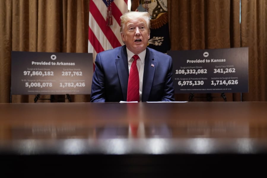 President Donald Trump speaks during a meeting with Arkansas Gov. Asa Hutchinson and Kansas Gov. Laura Kelly in the Cabinet Room of the White House, Wednesday, May 20, 2020, in Washington.