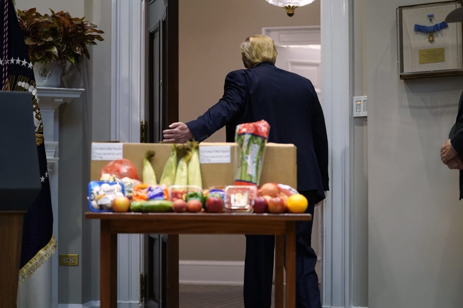 President Donald Trump leaves after an event on the food supply chain during the coronavirus pandemic, in the Roosevelt Room of the White House, Tuesday, May 19, 2020, in Washington.