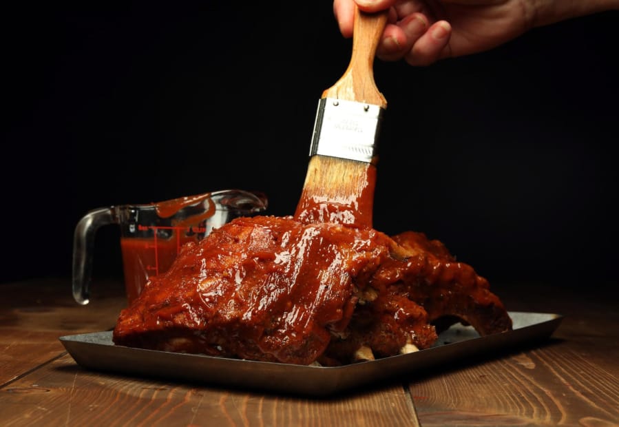 A homemade barbecue sauce on ribs.