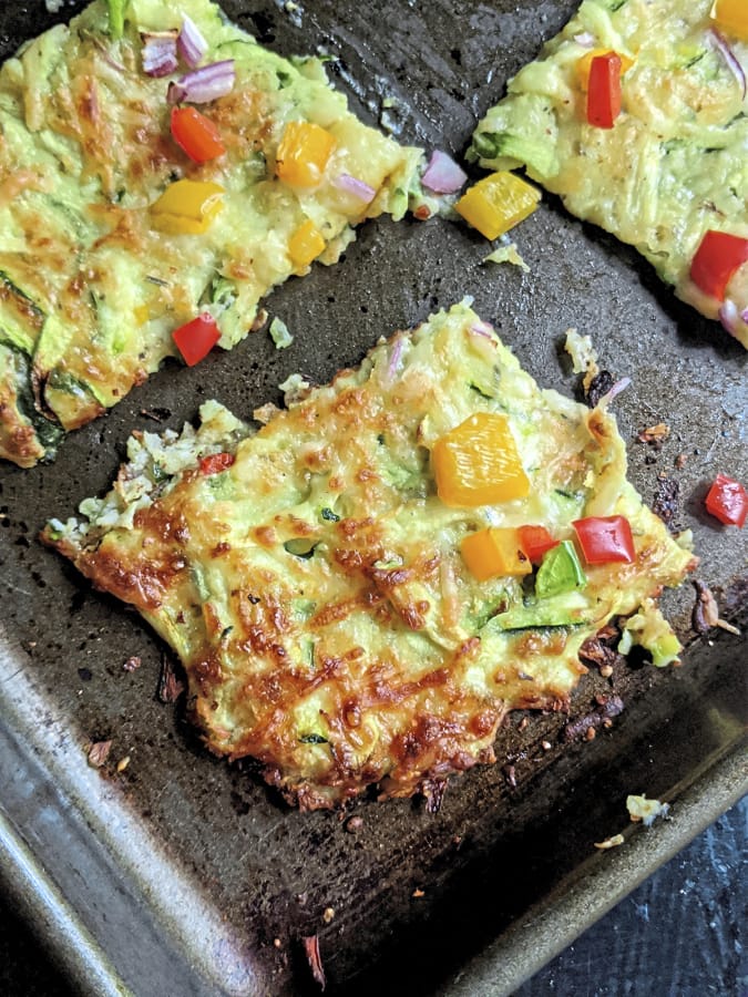 This vegetarian pizza is made with shredded zucchini, mozzarella and Parmesan cheeses and egg.