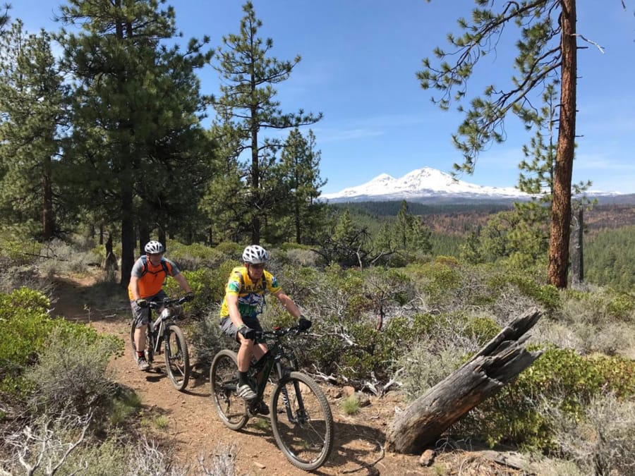 Mountain bikers ride along the Peterson Ridge West trail.