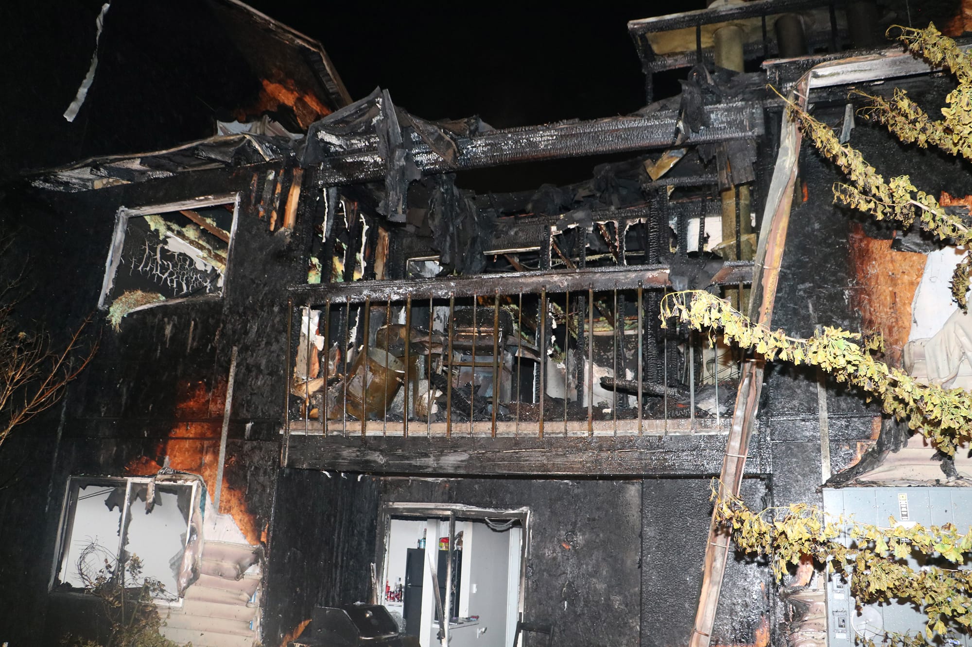 A two-alarm fire that heavily damaged a Sunpointe Apartments building, displacing more than 25 residents, was caused by improperly discarded smoking materials, according to the Vancouver Fire Marshal’s Office.