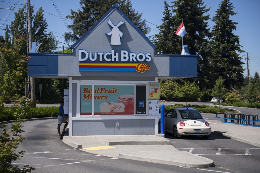 A customer stops by the Dutch Bros. Coffee stand at 9913 Northeast Hazel Dell Ave. The stand closed for a deep cleaning on Saturday after the company announced that one of the employees had tested positive for COVID-19.