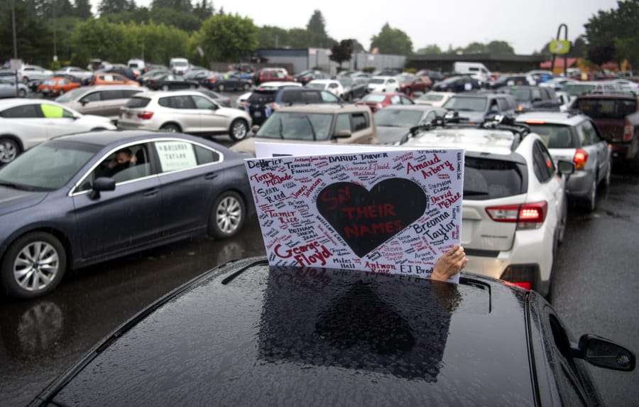 Around 1,500 cars Saturday filled the Town Plaza Center parking lot at  5411 E. Mill Plain Blvd. and the surrounding streets for &quot;Car Rally for Black Lives,&quot; organized by NAACP Vancouver and YWCA Clark County. The rally was held in memory of George Floyd and all the other black lives lost to racism and police brutality.