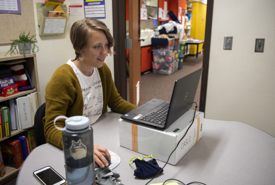 Speech-language pathologist Hillary Betzen waits to connect with a student for a session.