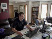 WIAA Executive Director Mick Hoffman, shown working out of his Vancouver home in 2020, said mask compliance by spectators will be key on whether or not fans will be allowed at state events for the winter postseason. “The biggest factor that’s going to determine whether fans get to attend (state events) and if they get to attend as usual is if the state Department of Health trusts people will follow the guidance,” Hoffman said.