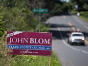 Campaign signs for the Clark County Council race have sprouted in east Vancouver: At top, signs for Republican Karen Bowerman and Democrat Jesse James; above a sign for incumbent John Blom, no party preference.