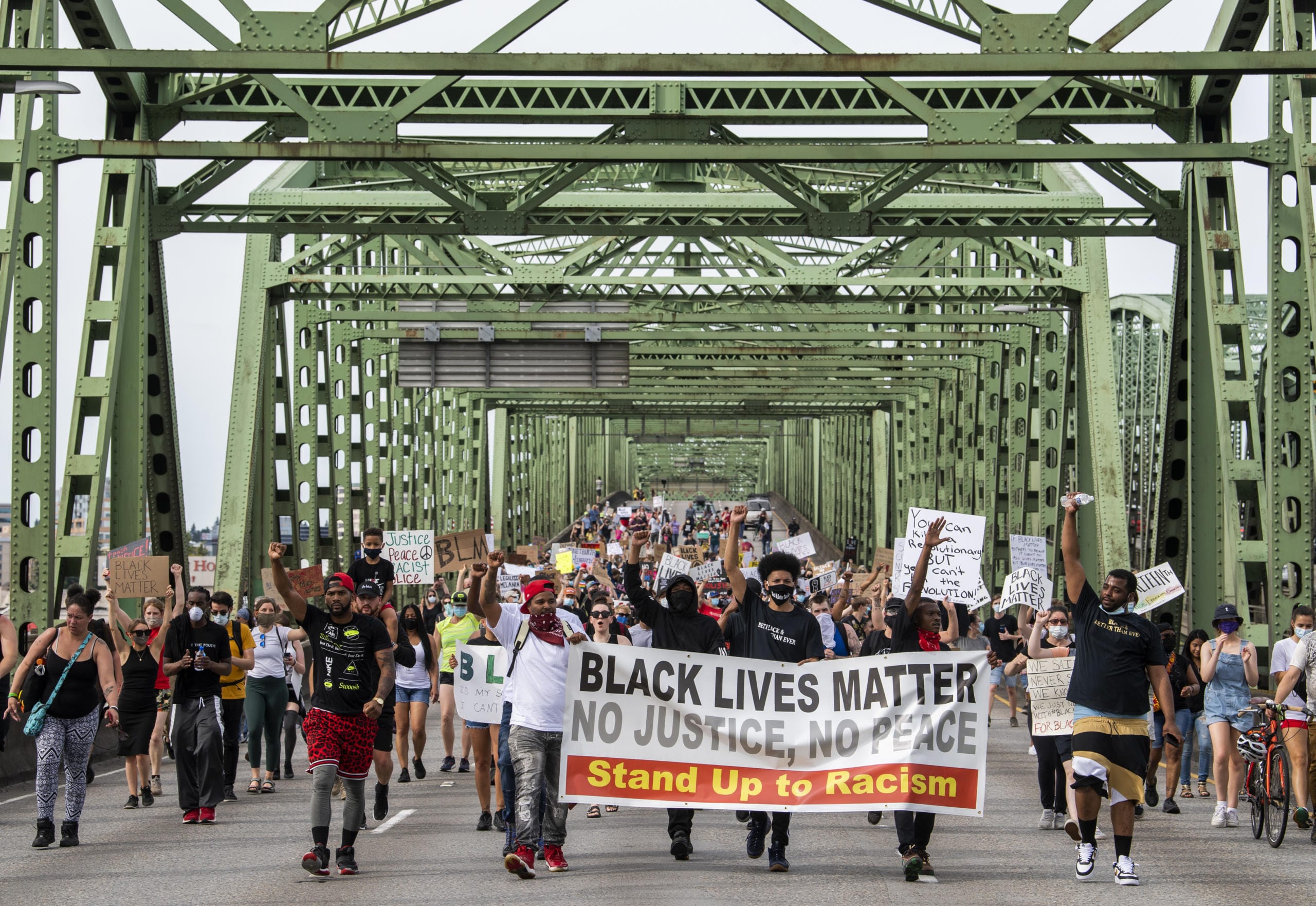 LEAD OPTION: Hundreds of demonstrators, led by founders of M.A.D PDX, marched from Esther Short Park across Interstate 5 to commemorate Juneteenth and rally together for Black lives Friday afternoon, June 19, 2020. Friday marked Juneteenth, the oldest holiday that commemorates the ending of slavery in the United States 155 years ago. Amid the upraising following the killing of George Floyd in police custody, this day is now being acknowledged as a holiday by corporations and state governments across the country.