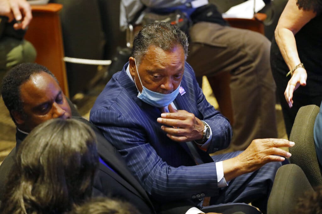 The Rev. Jesse Jackson talks with others in at North Central University Thursday, June 4, 2020, before a memorial service for George Floyd in Minneapolis.