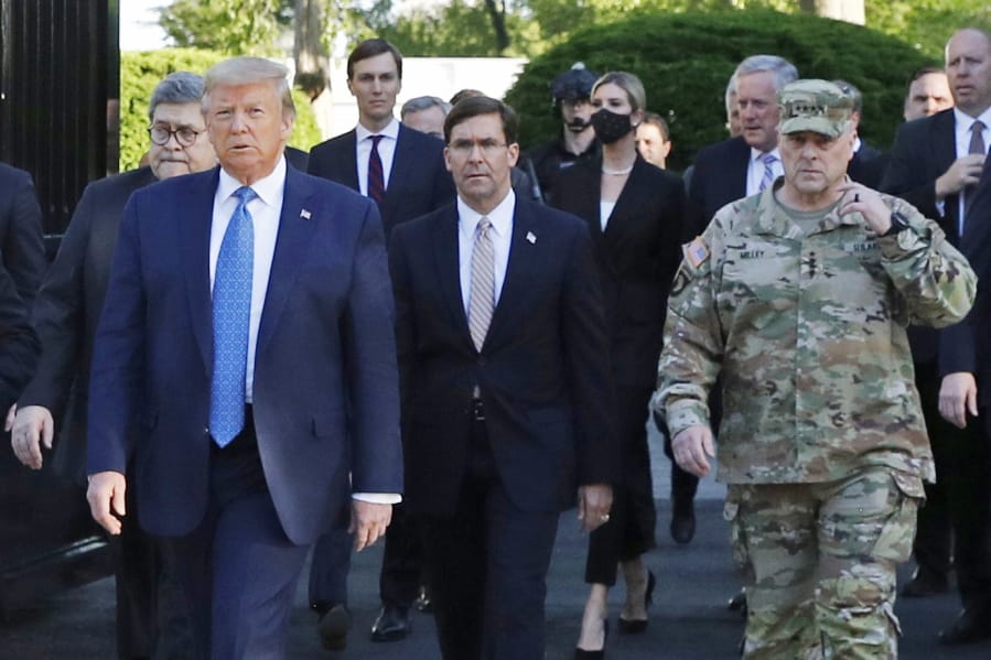 FILE - In this June 1, 2020 file photo, President Donald Trump departs the White House to visit outside St. John&#039;s Church, in Washington. Part of the church was set on fire during protests on Sunday night. Walking behind Trump from left are, Attorney General William Barr, Secretary of Defense Mark Esper and Gen. Mark Milley, chairman of the Joint Chiefs of Staff.  Milley says his presence &quot;created a perception of the military involved in domestic politics.&quot; He called it &quot;a mistake&quot; that he has learned from.