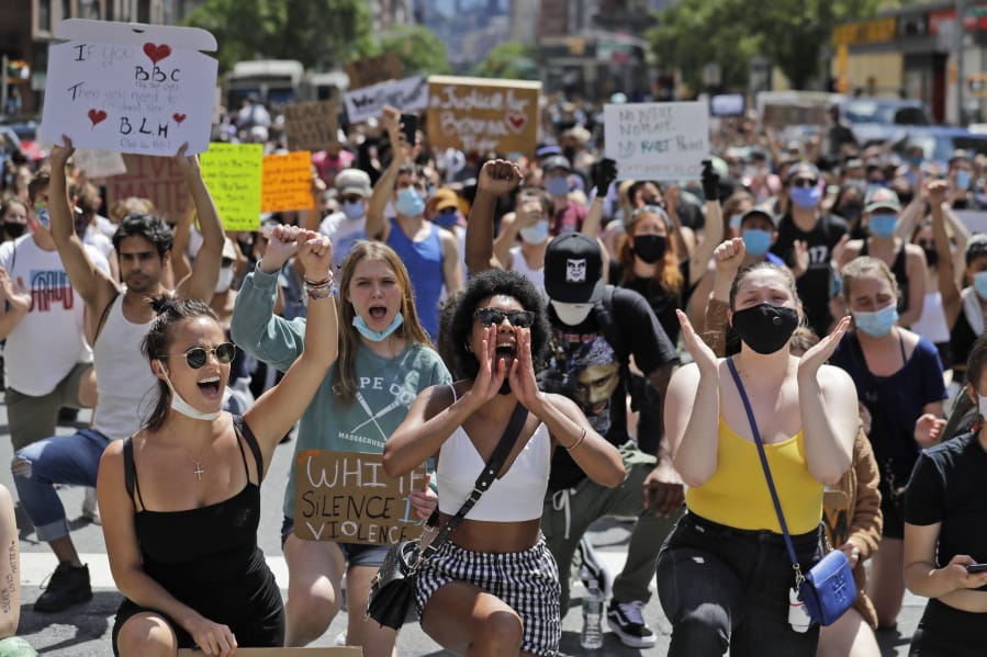 Protesters march through the streets of Manhattan, New York, Sunday, June 7, 2020. New York City lifted the curfew spurred by protests against police brutality ahead of schedule Sunday after a peaceful night, free of the clashes or ransacking of stores that rocked the city days earlier.