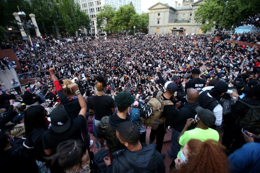 A crowd gather in Pioneer Square in downtown Portland by dusk on Tuesday, June 2, 2020 as protests continued for a sixth night in Portland, demonstrating against the death of George Floyd.