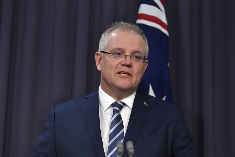 Australian Prime Minister Scott Morrison speaks at a press conference at Parliament House in Canberra, Friday, June 19, 2020. Australia is under increasing cyberattack from a &quot;sophisticated state-based cyber actor,&quot; Morrison said Friday.