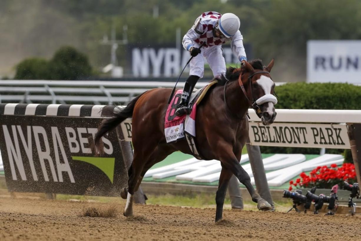 Tiz the Law (8), with jockey Manny Franco up, crosses the finish line to win the152nd running of the Belmont Stakes horse race, Saturday, June 20, 2020, in Elmont, N.Y.