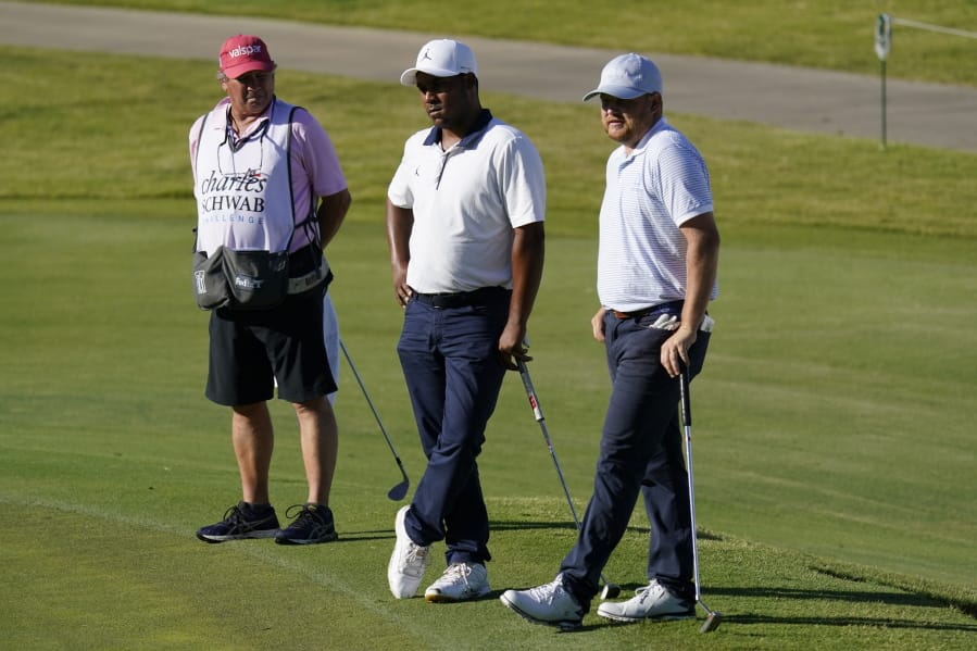 From right, Zac Blair, Harold Varner III and caddie Rick Wynn observe a moment of silence to pay their respects to the memory of George Floyd on the 16th hole during the second round of the Charles Schwab Challenge golf tournament at the Colonial Country Club in Fort Worth, Texas, Friday, June 12, 2020. (AP Photo/David J.
