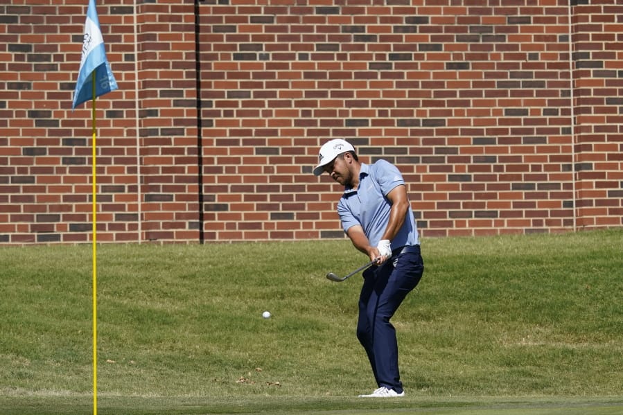 Xander Schauffele chips to the 16th green during the third round of the Charles Schwab Challenge golf tournament at the Colonial Country Club in Fort Worth, Texas, Saturday, June 13, 2020. (AP Photo/David J.