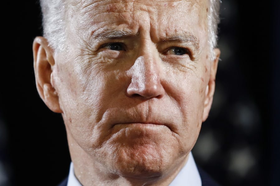 FILE - In this March 12, 2020, file photo Democratic presidential candidate former Vice President Joe Biden speaks about the coronavirus in Wilmington, Del. Biden has won the last few delegates he needed to clinch the Democratic nomination for president.