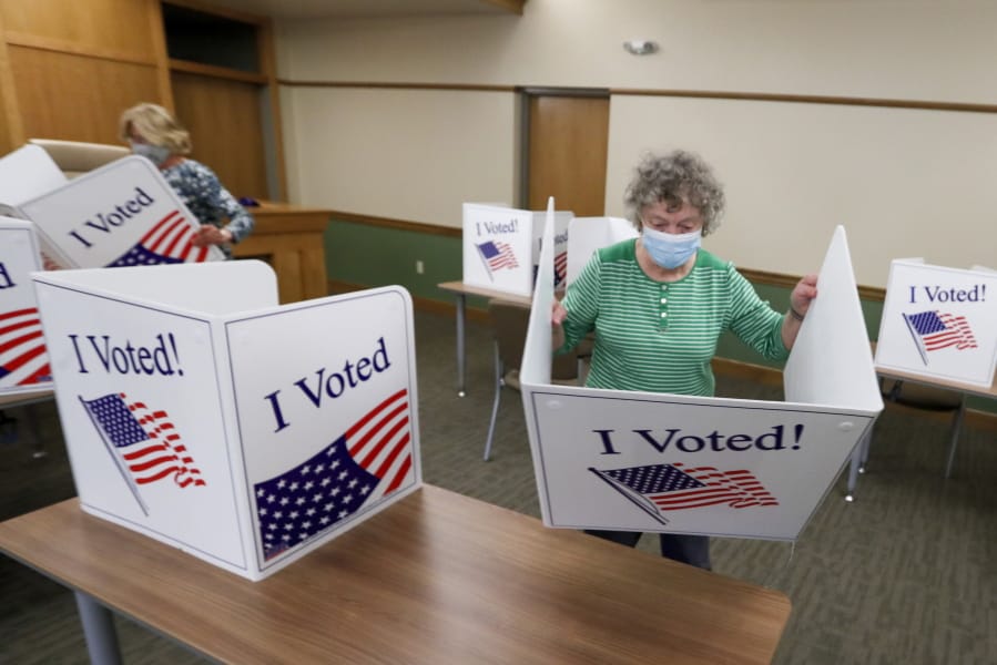 Marty Goetz, right, and Diane White, prepare the voting screens as they start to set up a polling place Monday, June 1, 2020, for the voting for Tuesday&#039;s Pennsylvania primary in Jackson Township near Zelienople, Pa.