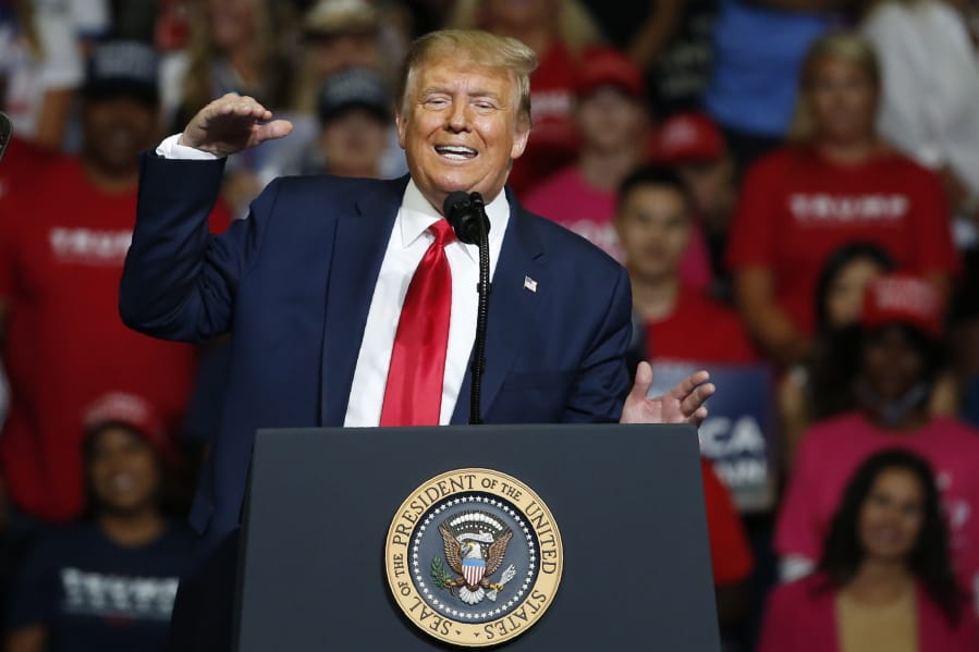 In this June 20, 2020, photo, President Donald Trump speaks during a campaign rally at the BOK Center in Tulsa, Okla.