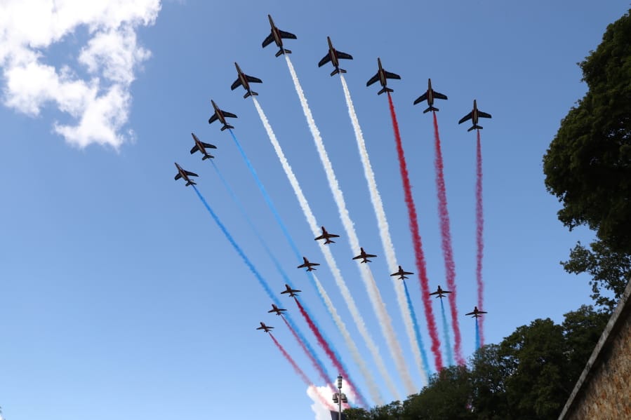 French Alpha jets of the Patrouille de France and the UK Royal red arrows aerobatic planes spraying lines of smoke in the colors of the French flag fly over the Mont-Valerien, a memorial for the French who fought against the Nazis and those who were killed by the occupying forces, in Suresnes, west of Paris, Thursday, June 18, 2020 at the start of the traditional annual ceremony of commemoration for the 80th anniversary of Charles de Gaulle&#039;s radio appeal to his countrymen to resist Nazi occupation during WWII. French President Emmanuel Macron is traveling to London to mark the day that De Gaulle delivered his defiant broadcast 80 years ago urging his nation to fight on despite the fall of France. In a reflection of the importance of the event, the trip marks Macron&#039;s first international trip since France&#039;s lockdown amid the COVID-19 pandemic.