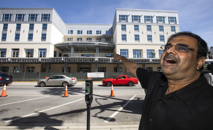 FILE - In this Oct. 23, 2019 file photo, developer Danny Gaekwad talks about the roof top bar on his Hilton Garden Inn hotel that is presently under construction  in Ocala, Fla.  Since the coronavirus crisis started, hotel owners say they are struggling to get relief on a type of loan that Wall Street investors buy.