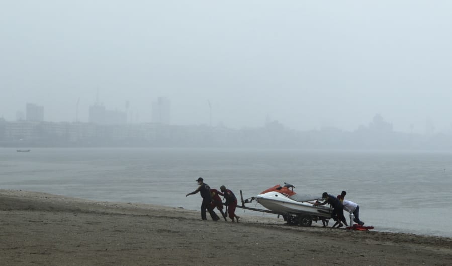 Rescue personnel relocate their jetski as part of precautions against cyclone on the Arabian Sea coast in Mumbai, India, Tuesday, June 2, 2020. Cyclone Nisarga in the Arabian Sea was barreling toward India&#039;s business capital Mumbai on Tuesday, threatening to deliver high winds and flooding to an area already struggling with the nation&#039;s highest number of coronavirus infections and deaths.