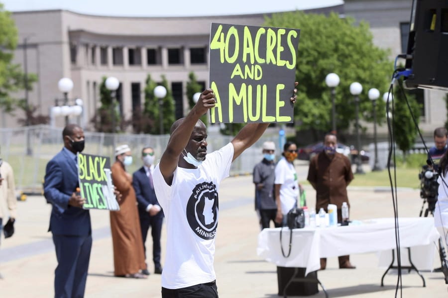 People demonstrate at the Minnesota State Capitol in St. Paul, Minn. on Friday, June 19, 2020, to mark Juneteenth, the day in 1865 when federal troops arrived in Galveston, Texas, to take control of the state and ensure all enslaved people be freed, more than two years after the Emancipation Proclamation.
