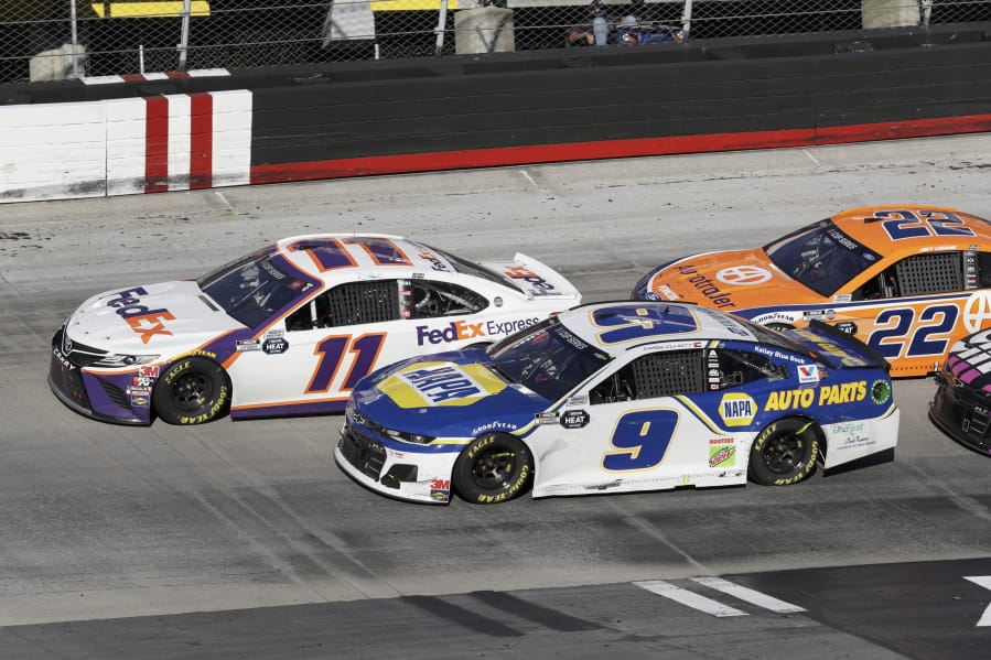 Denny Hamlin (11) drives followed by Chase Elliott (9) and Joey Logano (22) during a NASCAR Cup Series auto race at Bristol Motor Speedway Sunday, May 31, 2020, in Bristol, Tenn.