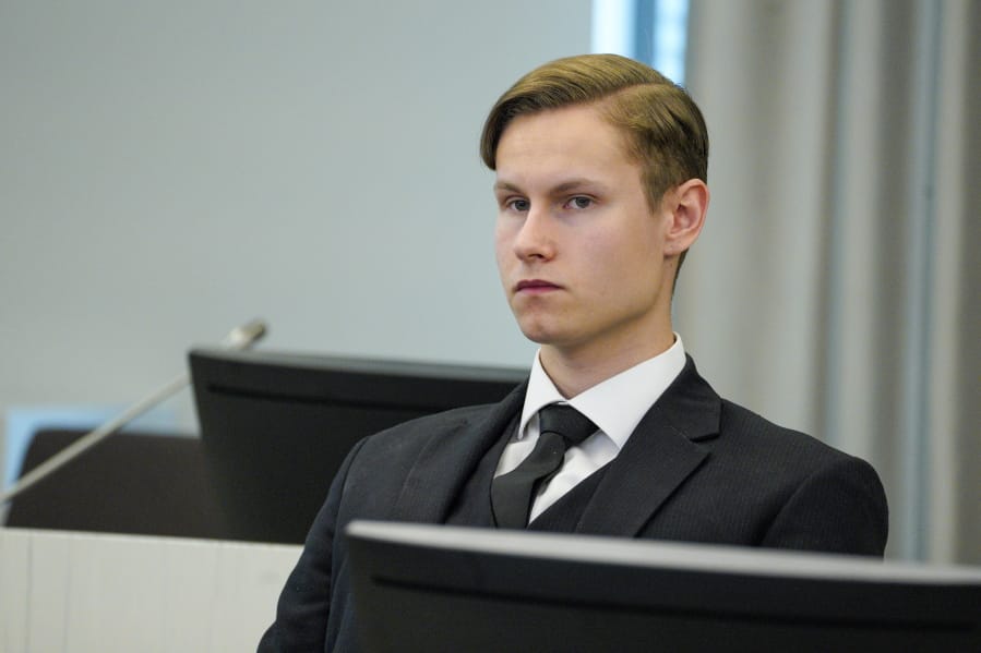 Defendant Philip Manshaus sits in a court room in Asker and Baerum district court in Sandvika, Norway, as he waits for the verdict on the last day of his trial, Thursday, Jun 11, 2020.  The Norwegian man is charged with murder and terrorism in the killing of his stepsister and the storming of an Oslo mosque, and, according to a Norwegian prosecutor, should get the maximum 21 years in prison.