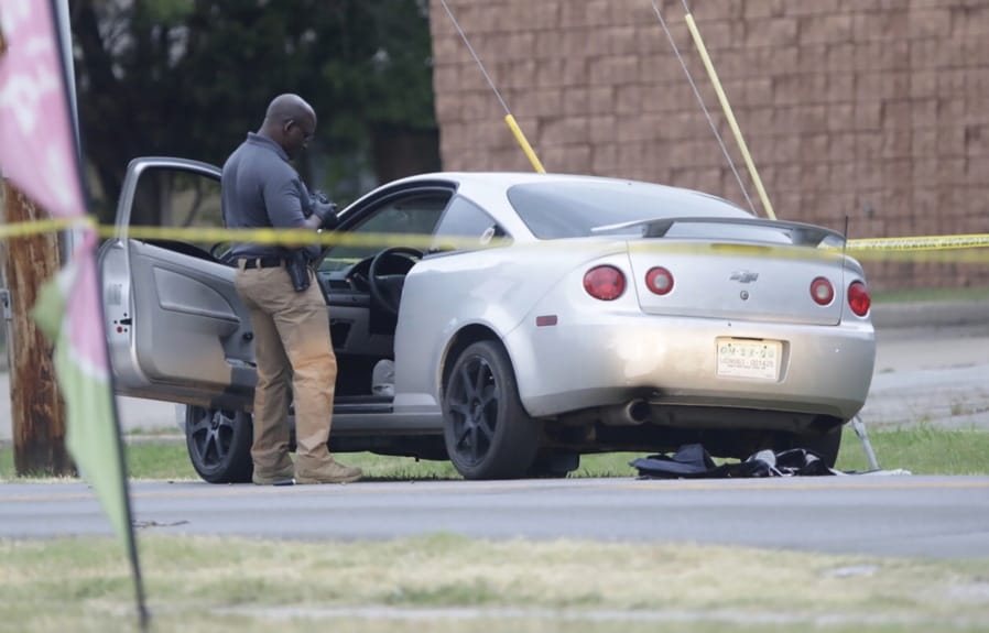 Officers investigate the scene of a shooting where two Tulsa Police Officers were shot Monday, June 29, 2020, in in Tulsa, Okla.