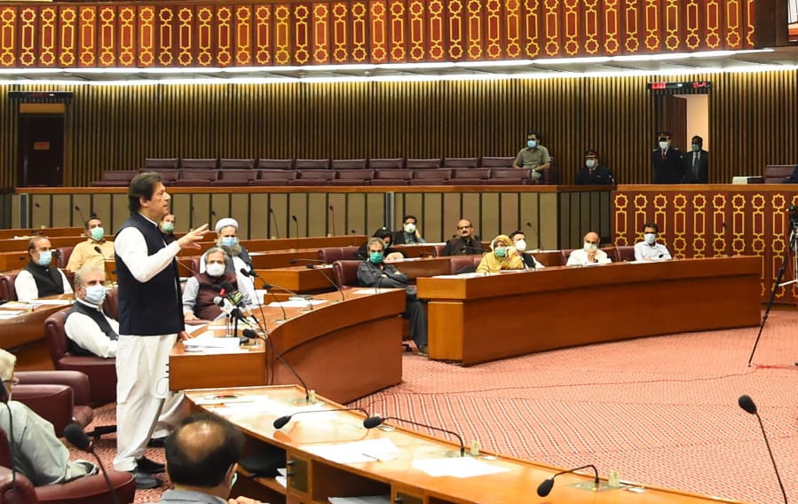 In this photo released by the Press Information Department, Pakistani Prime Minister addresses the Parliament in Islamabad, Pakistan, Thursday, June 25, 2020. Khan accused the United States on Thursday of having &quot;martyred&quot; al-Qaida leader and the mastermind of the 9/11 attacks, Osama bin Laden.