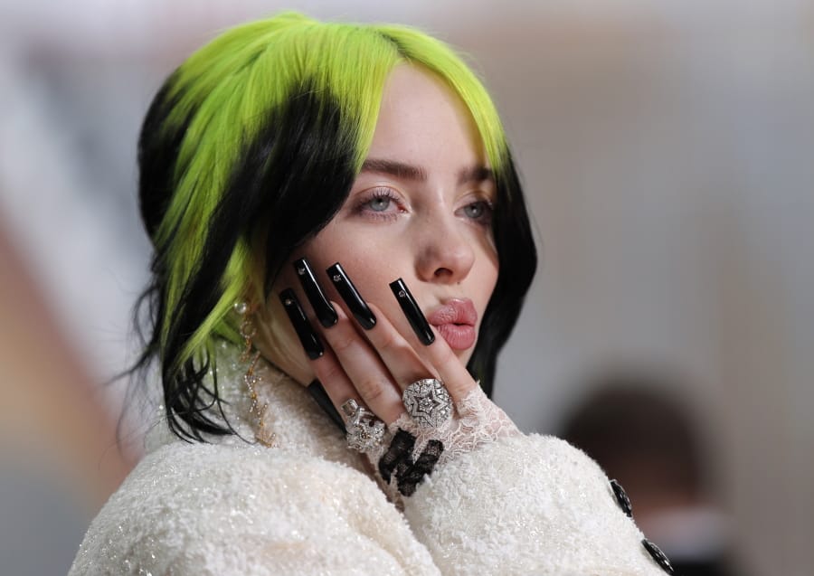 FILE - In this Feb. 9, 2020 file photo, singer Billie Eilish arrives at the Oscars in Los Angeles. A judge has extended to three years a restraining order taken out by Eilish against a man who repeatedly appeared at her Los Angeles home.