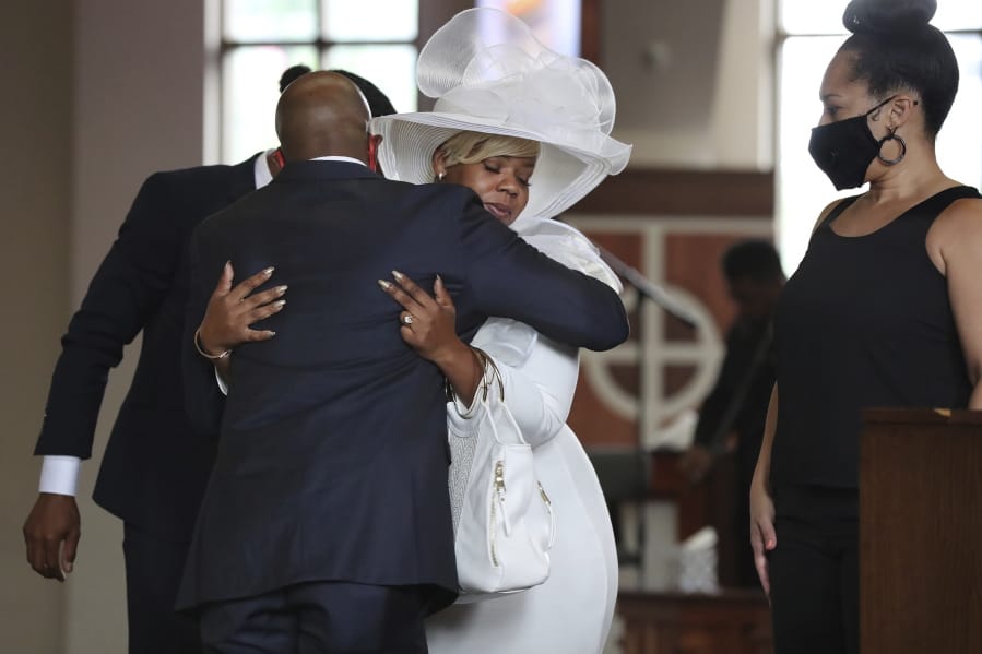 The Rev. Raphael G. Warnock, senior pastor of Ebenezer Baptist Church, comforts Tomika Miller, the wife of Rayshard Brooks during his public viewing at Ebenezer Baptist Church on Monday, Jun 22, 2020 in Atlanta. Brooks, 27, died June 12 after being shot by an officer in a Wendy&#039;s parking lot. Brooks&#039; death sparked protests in Atlanta and around the country. A private funeral for Brooks will be held Tuesday at the church.