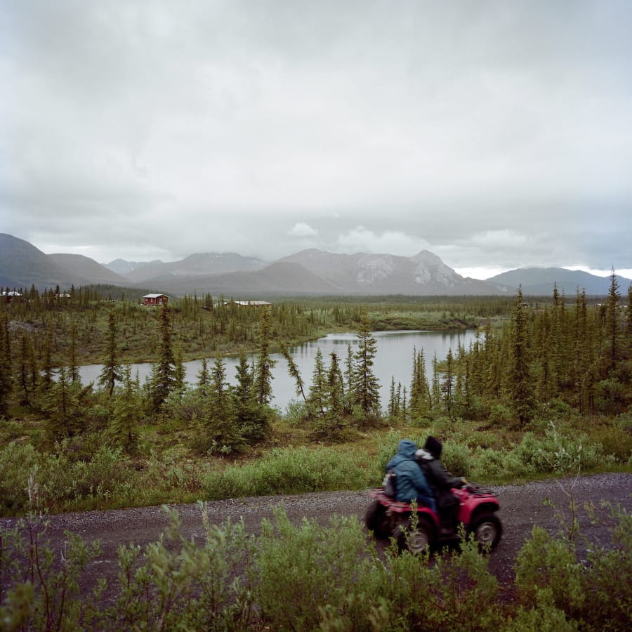 In this June 14, 2019 photo, a four-wheeler is ridden through Arctic Village, Alaska. If the pandemic has deepened the sense of isolation for the 8,000 or so Gwich&#039;in, sprinkled across northeastern Alaska into Canada, it has also emphasized the importance of the tribe&#039;s traditions and its profound spiritual connection to the homelands that sustain the caribou and other wildlife on which they depend.