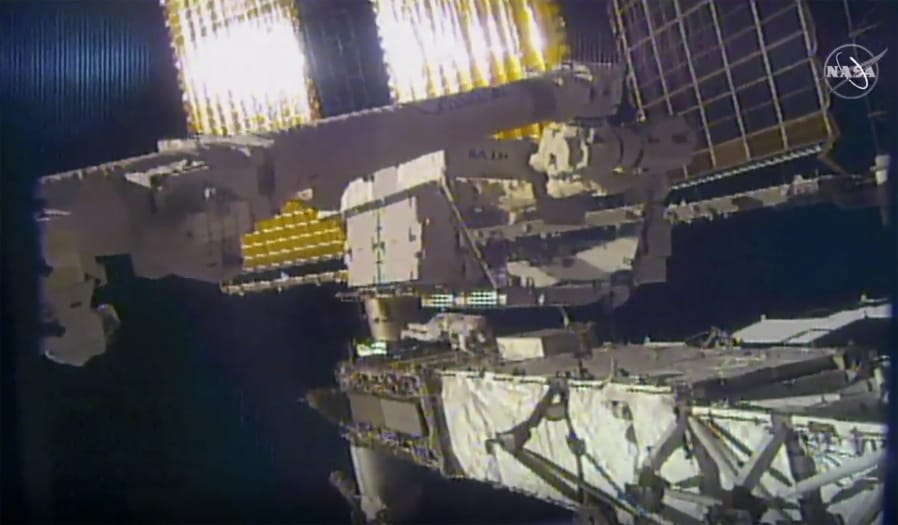 This photo provided by NASA shows NASA astronaut Chris Cassidy and NASA Flight Engineer Bob Behnken during a spacewalk outside the International Space Station on Friday, June 26, 2020.  Cassidy and Behnken, are conducting the first of at least four spacewalks to replace the last bunch of old station batteries.