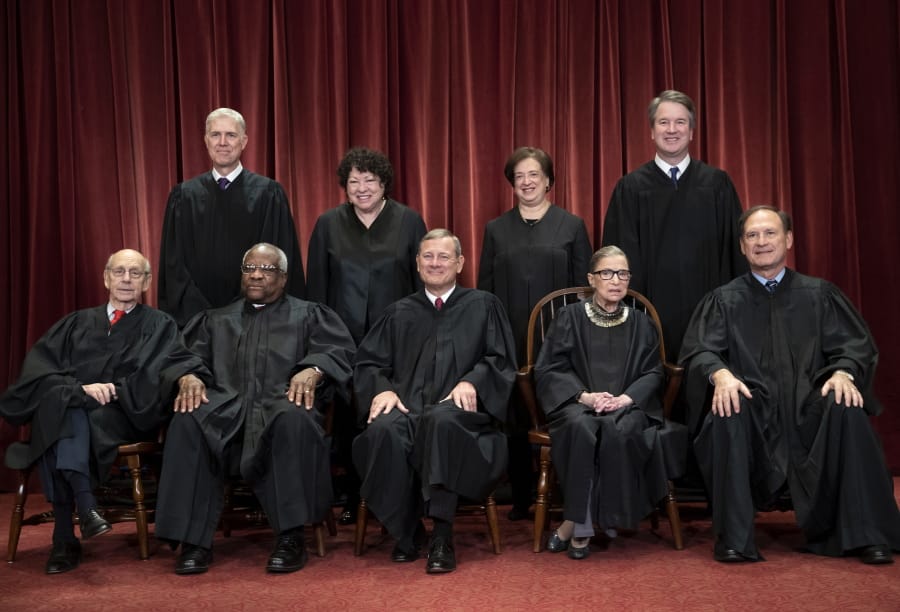 The justices of the U.S. Supreme Court gather in November 2018 for a formal group portrait to include a new associate justice, top row, far right, at the Supreme Court Building in Washington. Seated from left: Associate Justice Stephen Breyer, Associate Justice Clarence Thomas, Chief Justice of the United States John G. Roberts, Associate Justice Ruth Bader Ginsburg and Associate Justice Samuel Alito Jr. Standing behind from left: Associate Justice Neil Gorsuch, Associate Justice Sonia Sotomayor, Associate Justice Elena Kagan and Associate Justice Brett M. Kavanaugh.