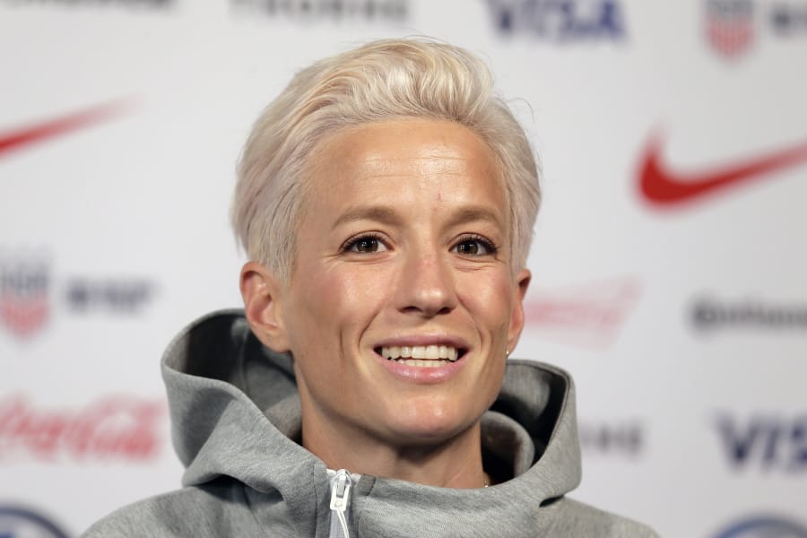 FILE - In this May 24, 2019, file photo, Megan Rapinoe, a member of the United States women&#039;s national soccer team, speaks to reporters during a news conference in New York. Seahawks quarterback Russell Wilson, soccer star Megan Rapinoe and three-time WNBA champion Sue Bird will preside over The ESPYS two-hour broadcast airing June 21 on ESPN. All three live in the Seattle area. Rapinoe and Bird are partners who share a household, which conveniently eases some logistics. Wilson&#039;s singer-wife, Ciara, is likely to make an appearance, too.