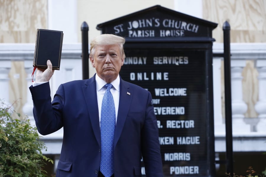 President Donald Trump holds a Bible as he visits outside St. John&#039;s Church across Lafayette Park from the White House Monday, June 1, 2020, in Washington. Park of the church was set on fire during protests on Sunday night.