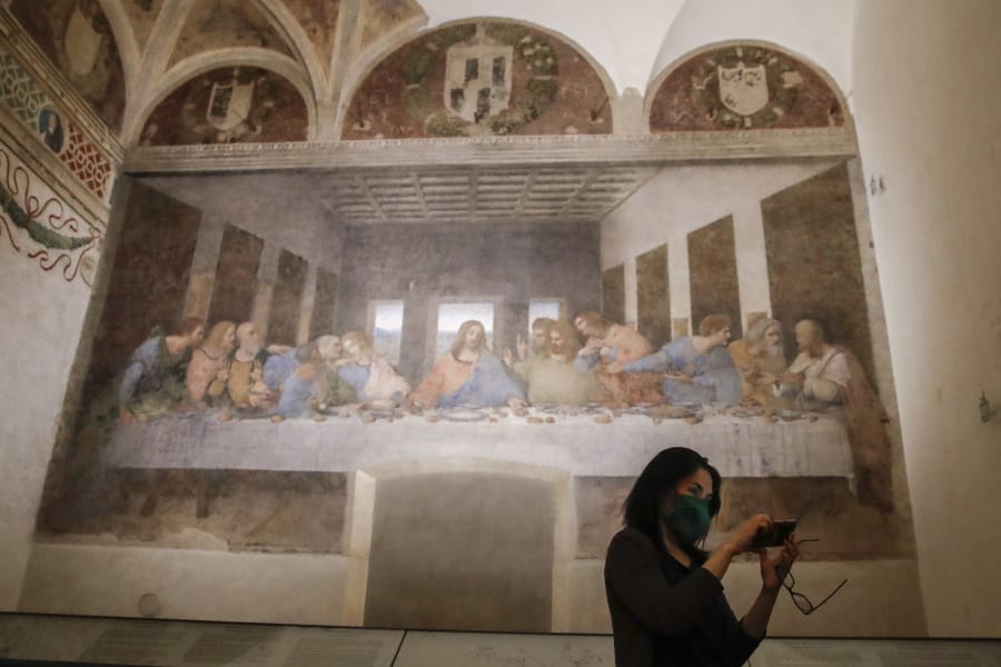 A visitor takes a selfie as she admires Leonardo da Vinci&#039;s mural painting &#039; The Last Supper &#039;, dating back to 1495-1498 and preserved at the ex-Renaissance refectory of the convent adjacent to the sanctuary of Santa Maria delle Grazie church, in Milan, Italy, Wednesday, June 10, 2020. &#039;Last Supper&#039; reopened Tuesday after three months of closure due to COVID-19 lockdown measures.