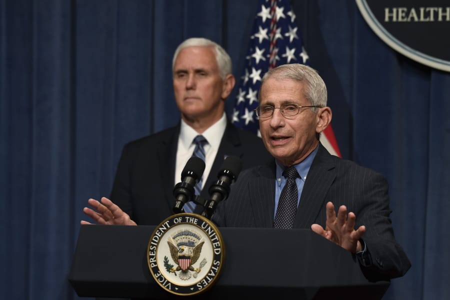 Dr. Anthony Fauci, right, director of the National Institute of Allergy and Infectious Diseases, speaks during a briefing with members of the Coronavirus Task Force, including Vice President Mike Pence, left, at the Department of Health and Human Services in Washington, Friday, June 26, 2020.